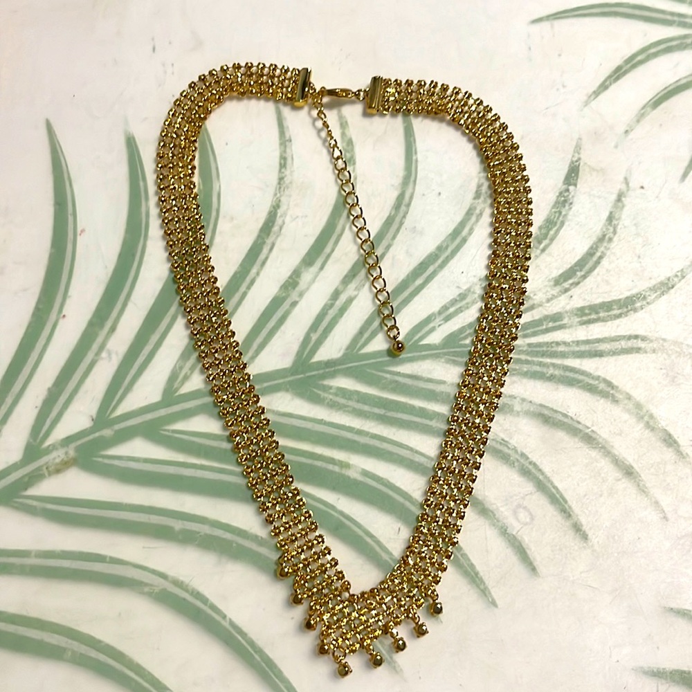Goldtone mesh necklace with rhinestone accents